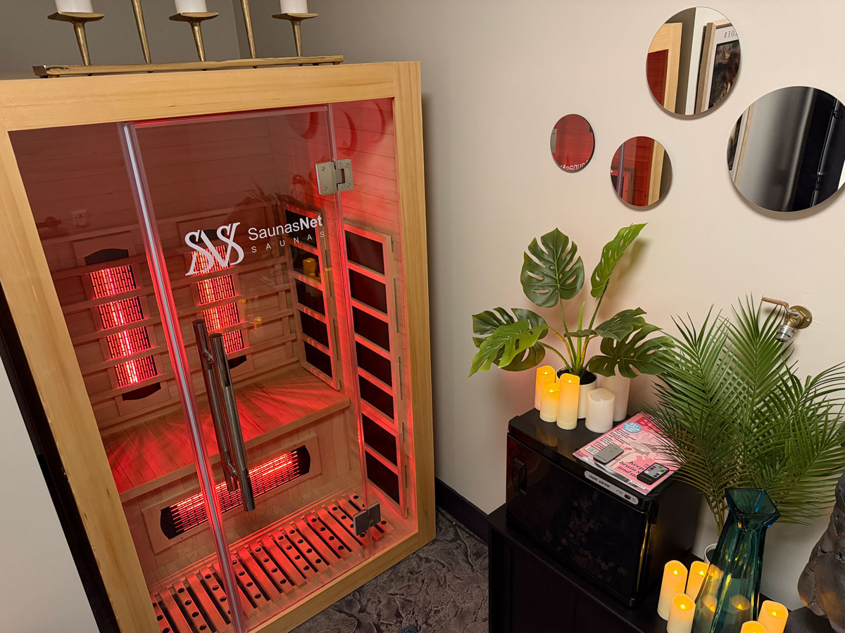 image of warm orange sauna with some plants and candles